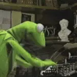 Kermit typing on a typewriter