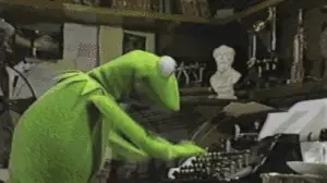 Kermit typing on a typewriter